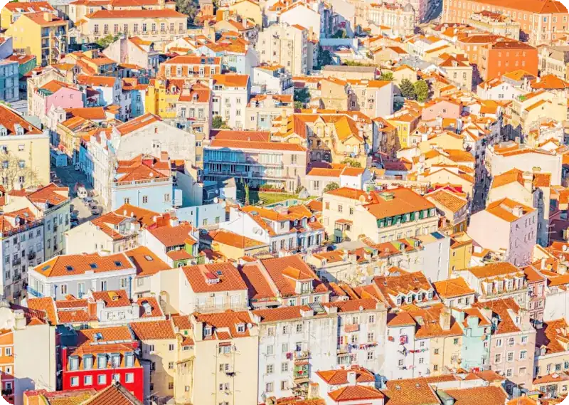 Traditional Portuguese house with a red roof, representing investment in property in Portugal.